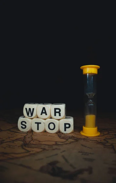 Vertical Closeup Hourglass Cube Words Stop War World Map — Stock fotografie