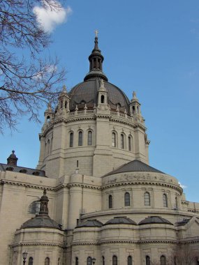 A Minnesota St paul cathedral catholic church with blue sky clouds tree architect