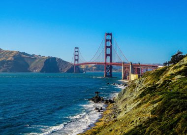 A distant view of the Golden Gate Bridge on a sunny day in San Francisco, California, United States