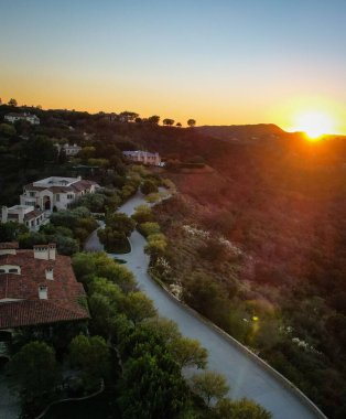 A vertical aerial view of a sunset sky over the Hollywood area in California