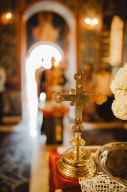 A selective of a golden cross in a church