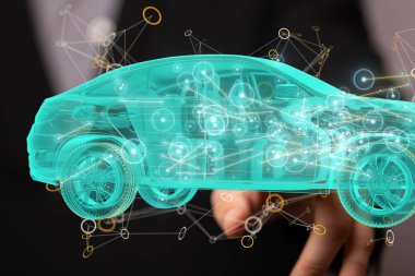 3 boyutlu bir arabayı işaret eden bir adam fotoğrafı.