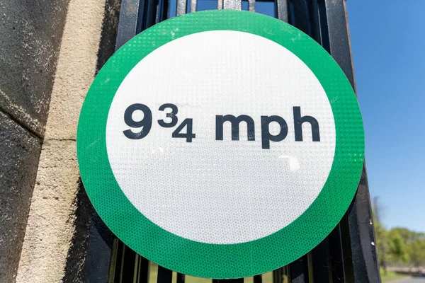 Unusual Road Sign Nine Three Quarter Miles Hour Green Circle — Stock Photo, Image