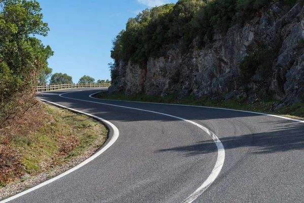 The Landscape of clean asphalt curly road in Serra da Arrabida in Setubal, Portugal