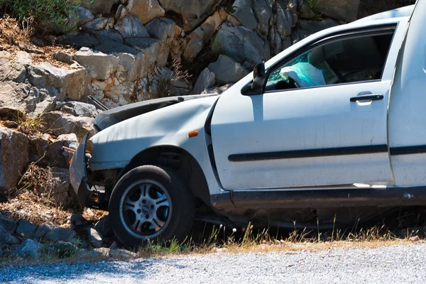 Careless Driver Hits His Car Rocks — Photo