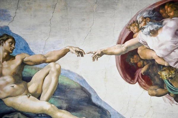 A painting of creation of Adam by Michelangelo at the Sistine chapel