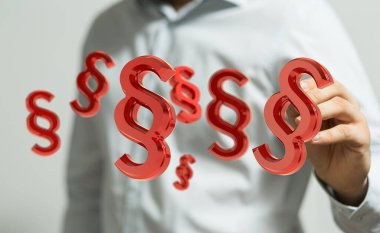 Bir elin yakınındaki illüstrasyonlu Yasaları Koruma Sembolleri 'nin yakın çekimi