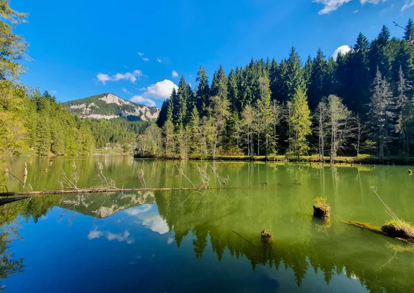 Landscape with Red Lake - Romania in summer, green, blue sky