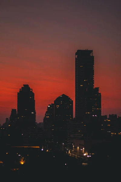 Vertical View Partially Illuminated Urban Buildings Red Sunset Sky Background — Stock Photo, Image