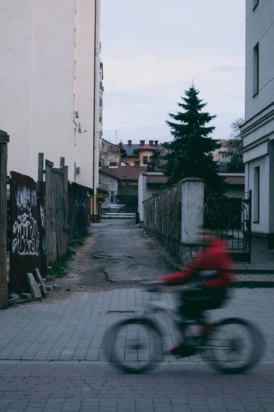 Narrow Alley Commercial Buildings Male Riding His Bicycle Road Foreground — Zdjęcie stockowe