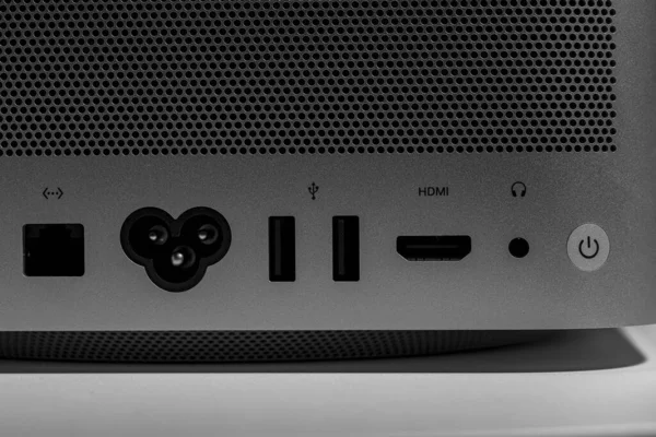 Backside ports and ventilation grid low key still life of modern new desktop computer system