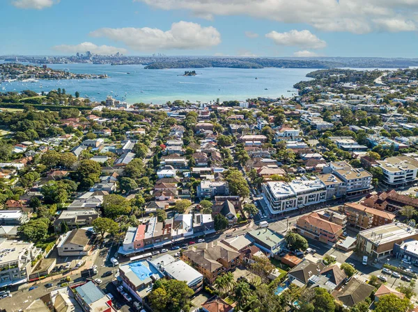 Aerial view of Sydney\'s business buildings overlooking the skyline and Harbour Bridge, with the main sights of the city and the waterfront