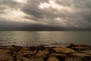 A scenic view of a vast ocean during a cloudy weather