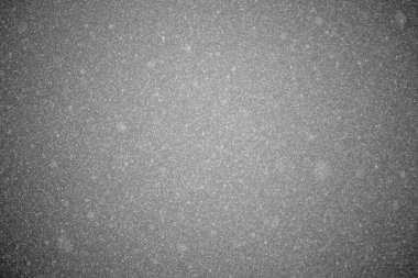 dense and glittering rainfall in gray cloudy sky