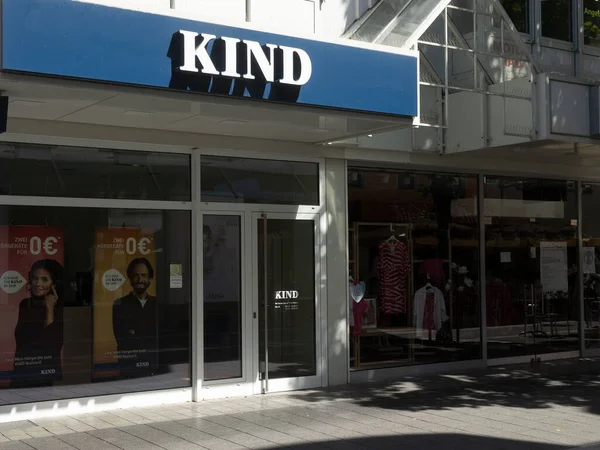 Neuwied, Germany - June 12, 2022: shop window and front of the local KIND shop. KIND is a German retailer for hearing aid devices