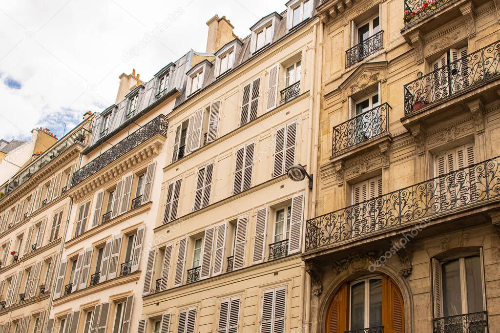 Paris, typical facade and windows, beautiful building in Montmartre