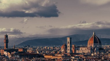 A scenic view of the Cathedral of Santa Maria del Fiore in Florence, Italy in cloudy sky background