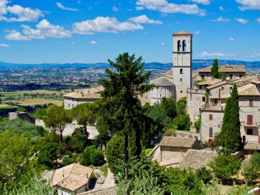 view of the city of assisi in the region of umbria in central italy on a summer day