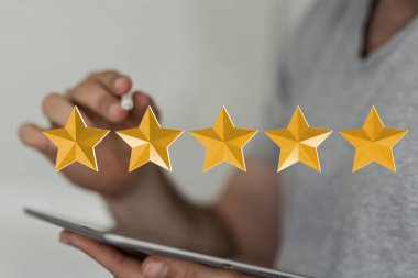 A businessman hand on blurred background using 3D rendering 5 stars icon