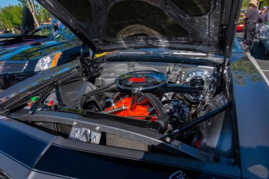 The engine bay of a classic black car
