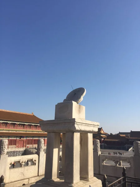 A vertical shot of the Sundial tower of the Hall of Supreme Harmony in Beijing, China