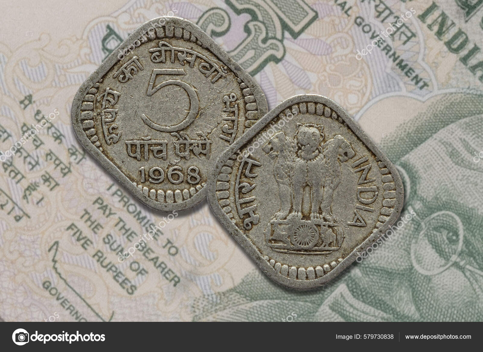古老的印第安百色硬币的正面和反面印度通货膨胀前的卢比面额——图库图片© wirestock_creators #579730838