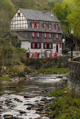 A beautiful view of the Cafe Thelen at the river Rur in the city of Monschau, Eifel, Germany