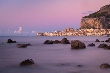 A beautiful view of the city of Cefalu by the sea in Sicily, Italy
