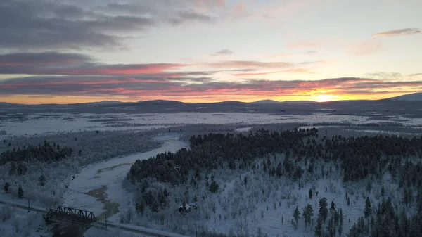 Aerial View Frozen River Flowing Snow Covered Forests Cloudy Sunset — Stock Photo, Image