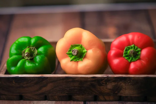 bel peppers capsicum on a wooden tab