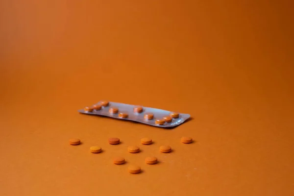 Closeup Shot Orange Pills Orange Background - Stock-foto
