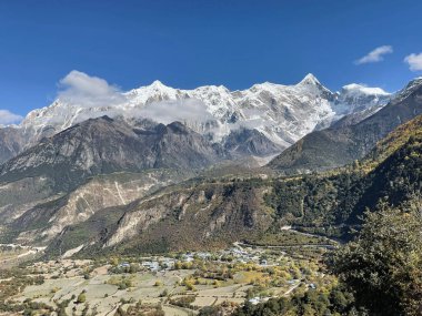 A beautiful view of mountains and clouds in sunny weather