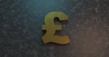 golden british currency sign on concrete