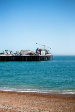 Brighton Palace Pier and Brighton beach, England, UK in summer time
