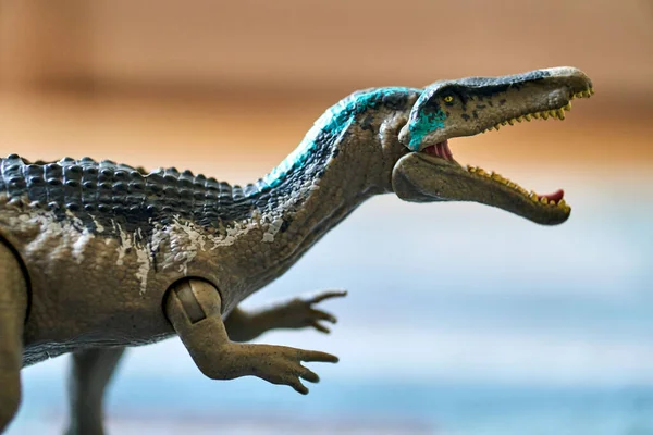 Closeup Shot Mini Dinosaur Toy Figurine Bright Light Blurred Background — Fotografia de Stock