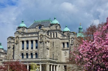 A beautiful shot of the Legislative Library of British Columbia against blue cloudy sky in bright sunlight, Canada