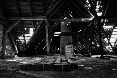A grayscale shot of an interior of the abandoned psychiatric department building
