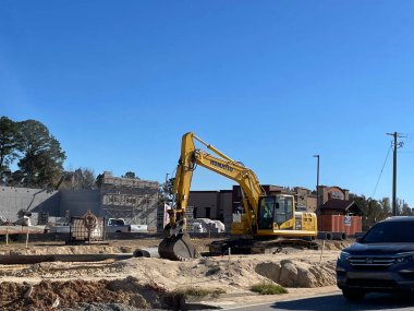 Grovetown, Ga USA - 11 24 21: Back hoe digger at a construction site roadside