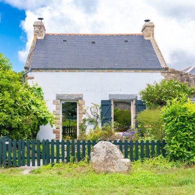 Carnac in Brittany, typical house in a stones field