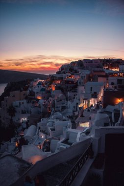 A vertical drone view of Santorini (Thira) at sunset, Greece