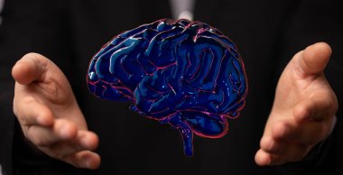 A closeup of illustrated brain near the hands