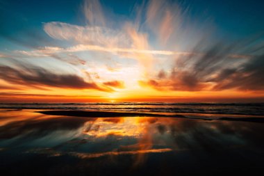A panoramic view of a beautiful sunset over the lake