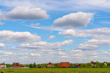 A beautiful view of white clouds on a bright blue background. Atmospheric weather phenomenon