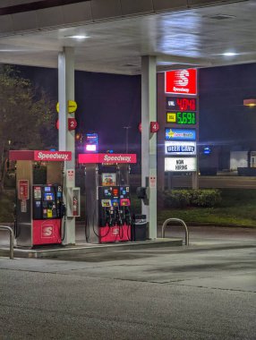 A vertical shot of gas pumps in the gas station in Palm Harbor, USA