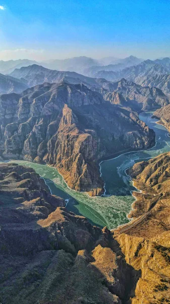 An aerial view of mountains and rivers in Pearl Lake, China