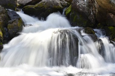 A small waterfall in the natural landscape