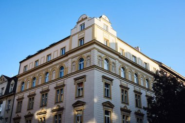 An old building in Prague on the square of Jiri Z Podebrad against a clear cloudless sky