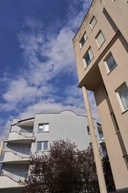 A vertical low angle view of an apartment building in the Stare Zegrze district.