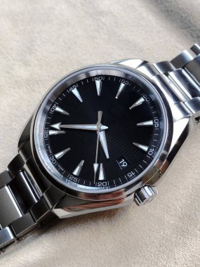 A closeup of an elegant silver watch isolated on a white background