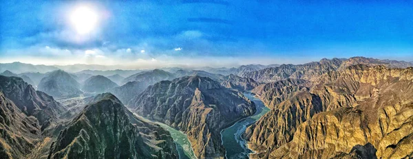 An aerial view of mountains and rivers in Pearl Lake, China